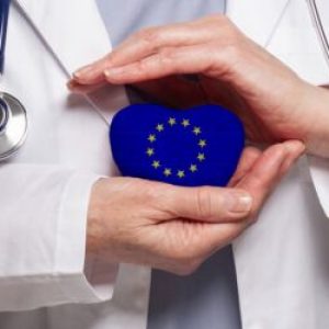 Eu,Doctor,Holding,Heart,With,Flag,Of,European,Union,Background.